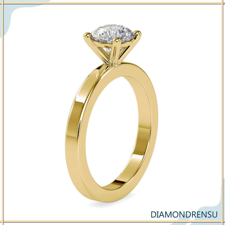 Designer ring in white gold with 4 prong round diamond.