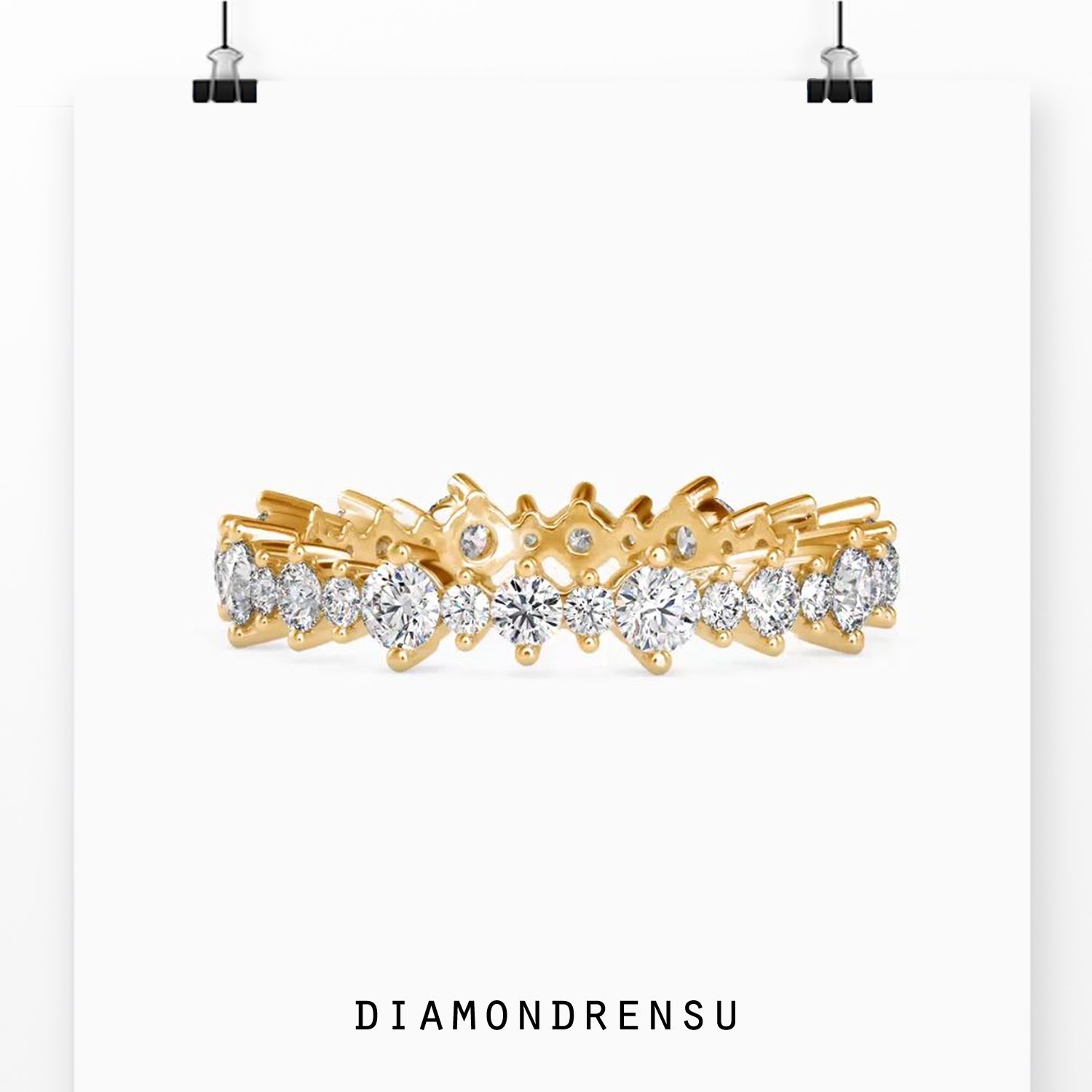 Gold wedding band featuring full circle round cut diamonds.