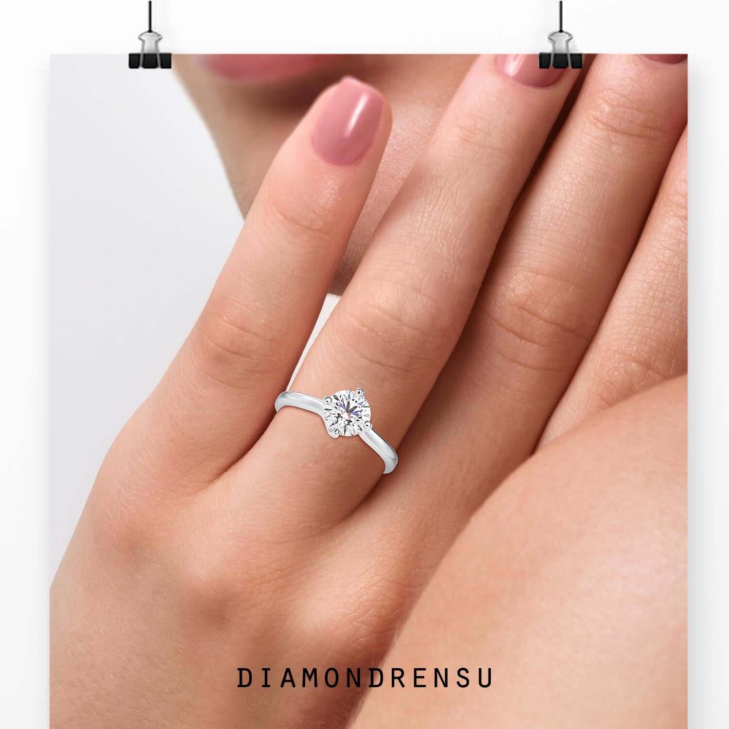 White gold diamond ring with compass prong setting.