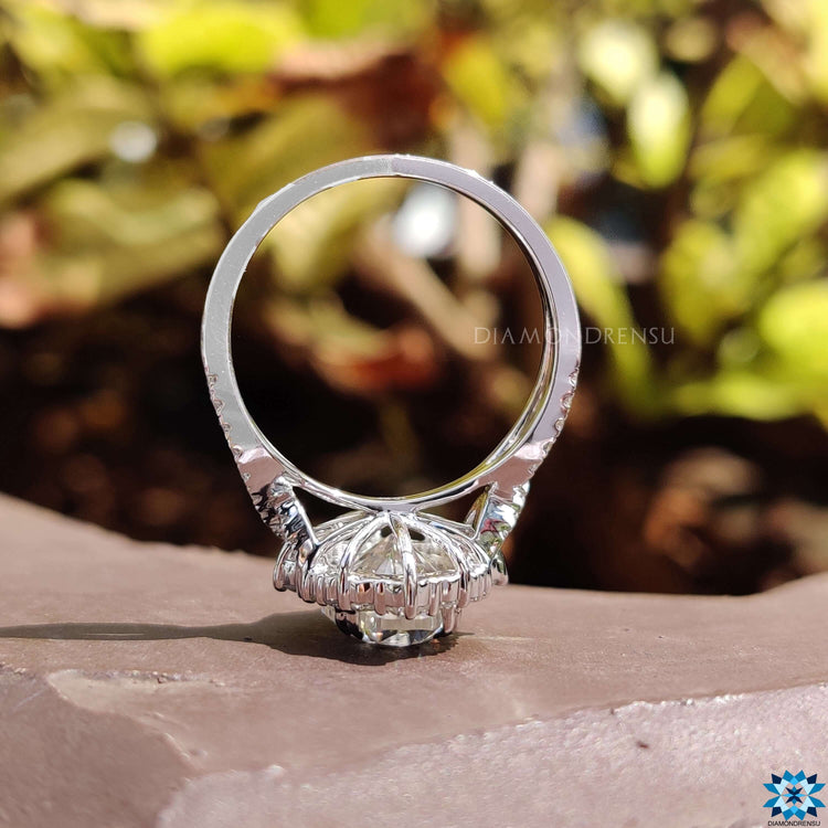 Handmade moissanite ring with twisted pave band design.