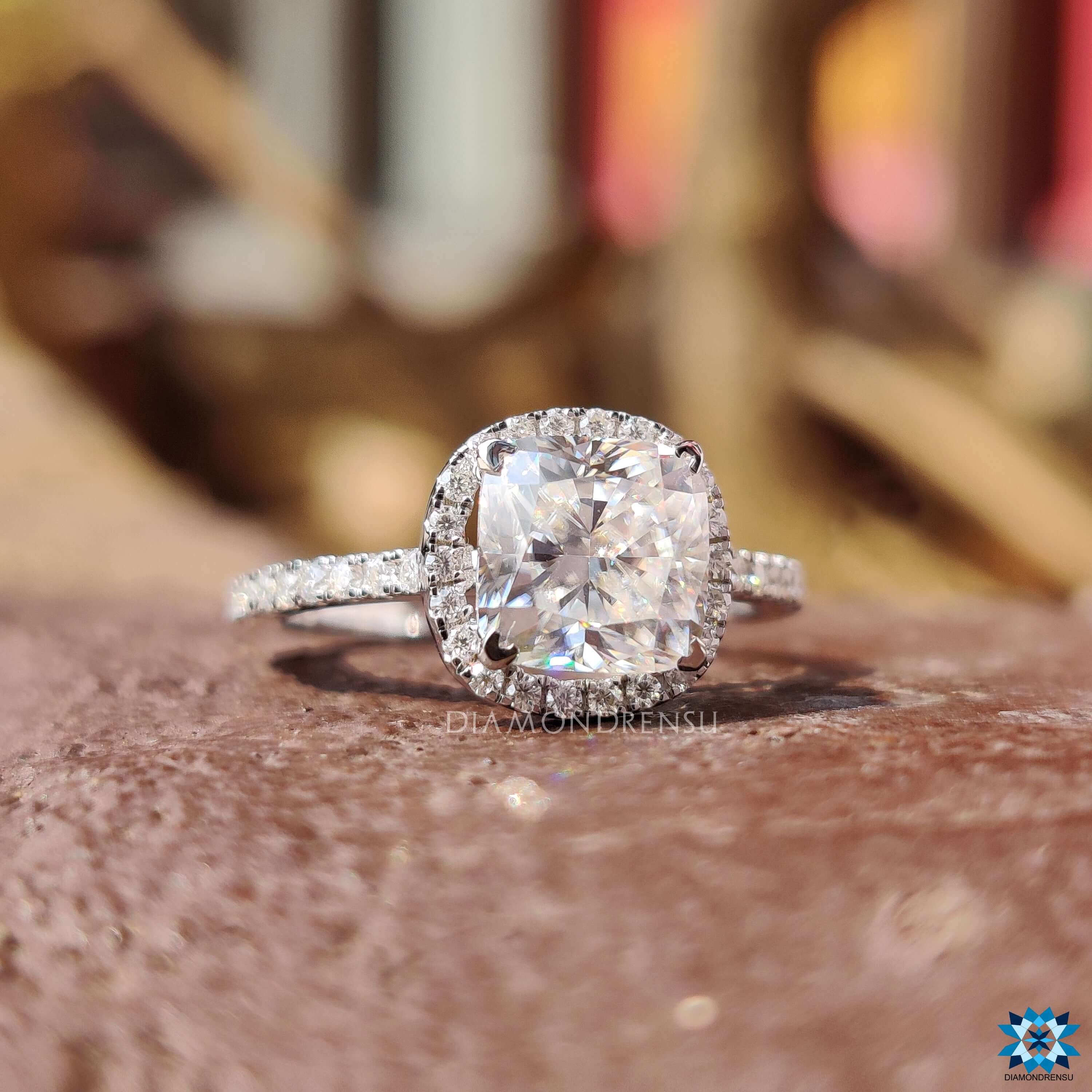 Handmade cushion cut moissanite ring in cathedral setting.