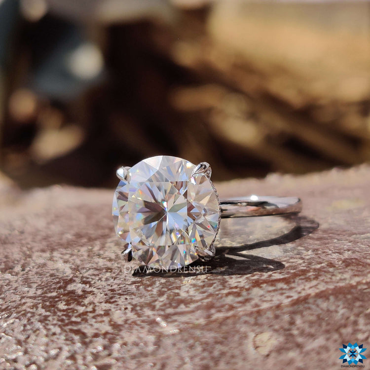 White gold ring with round cut hidden halo setting.