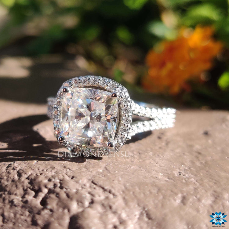 Split shank cushion cut engagement ring in prong setting.