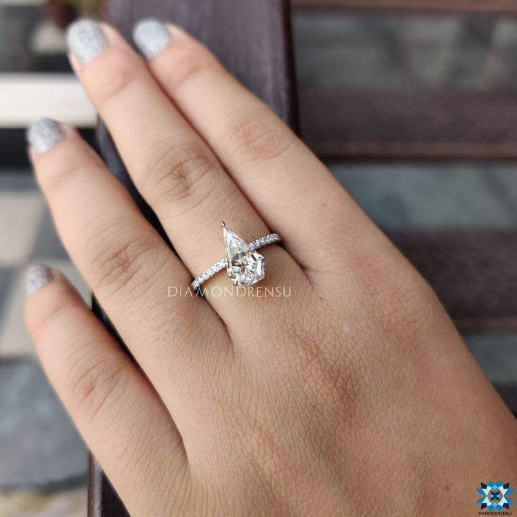 3 claw prong ring with white gold and moissanite center.