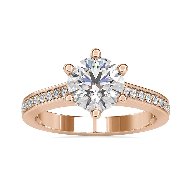 UK engagement ring with round cut diamond and 6 prong mount.