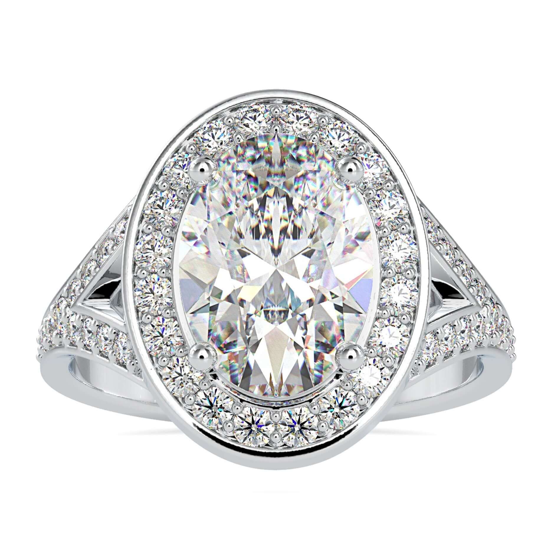 Vintage diamond cluster ring with oval cut centre stone.