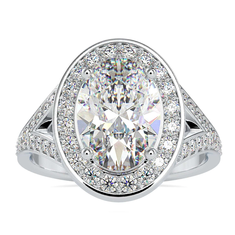 Vintage diamond cluster ring with oval cut centre stone.