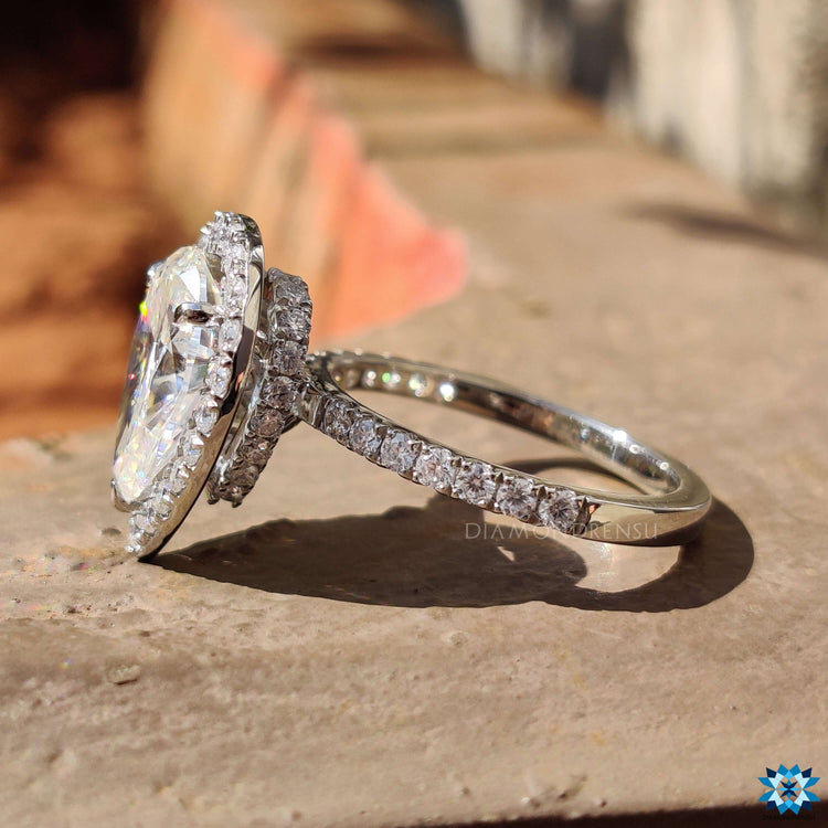 Custom engagement ring with pave and halo details.