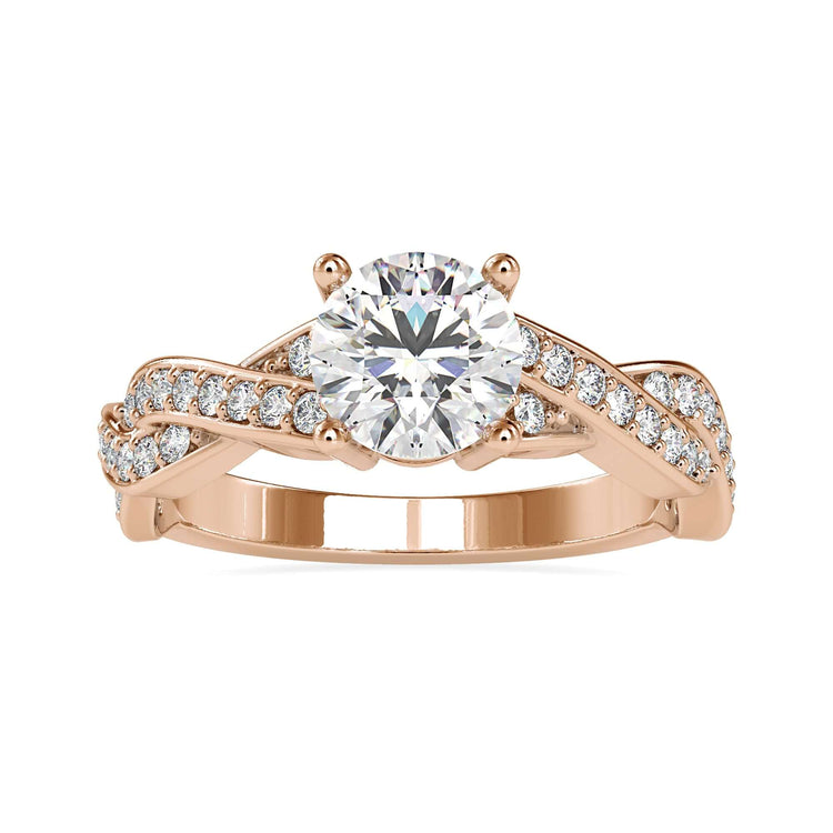 Round cut diamond ring with twisted band in UK style.