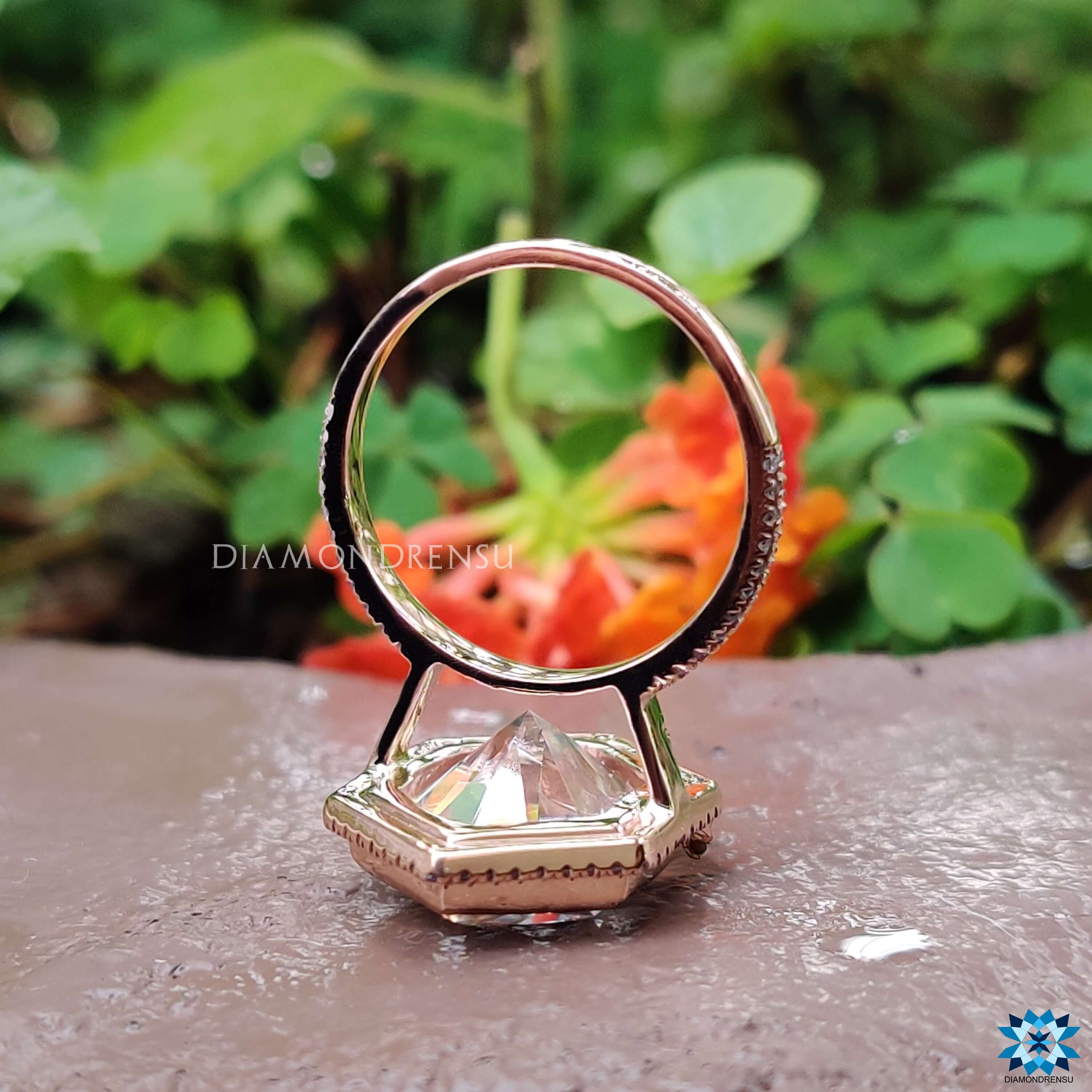 Moissanite halo ring with double row pave in rose gold.