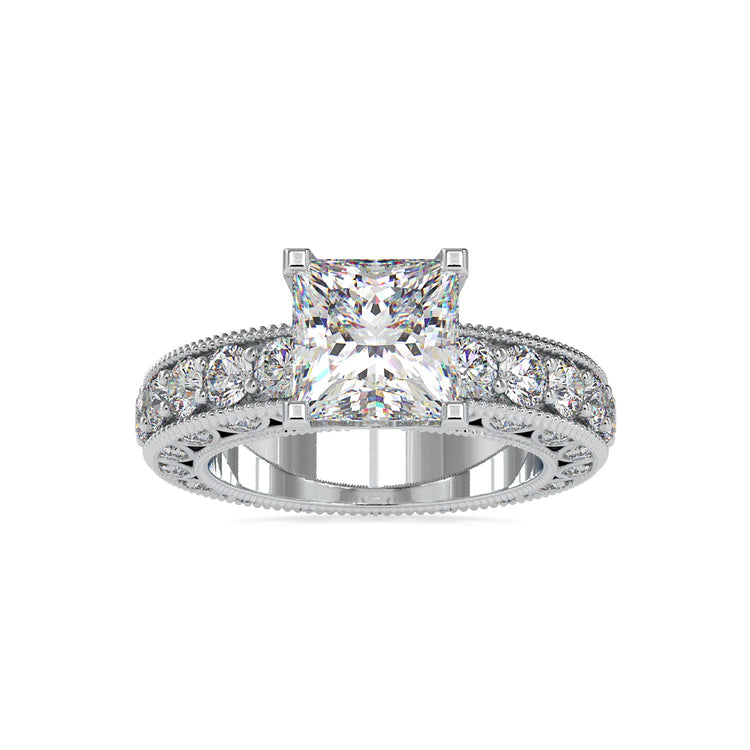 Simple diamond ring with princess cut and pave sides.