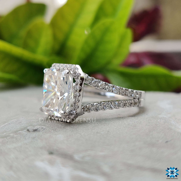 Radiant cut halo ring with split shank band.
