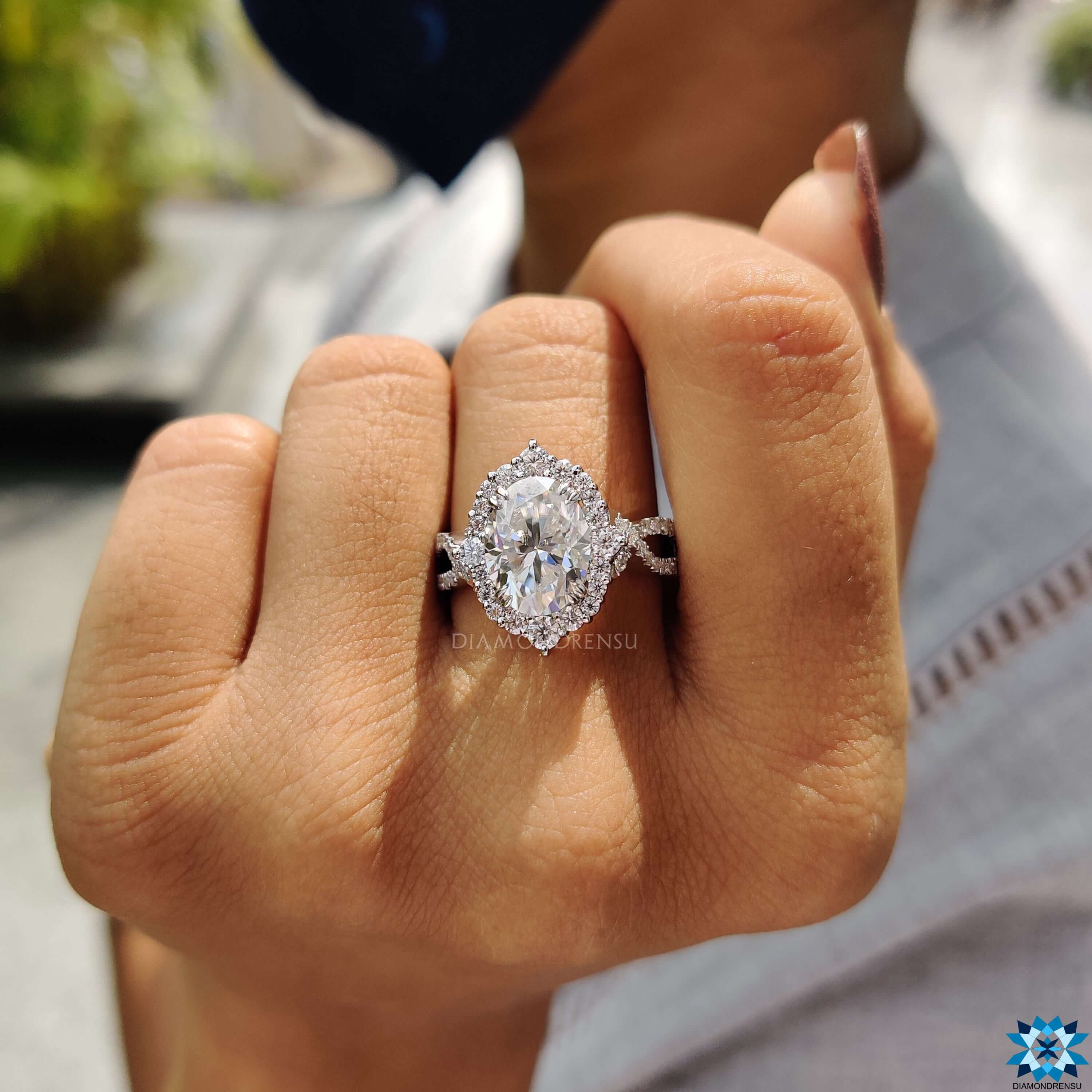 Moissanite halo ring featuring round cut halo setting.