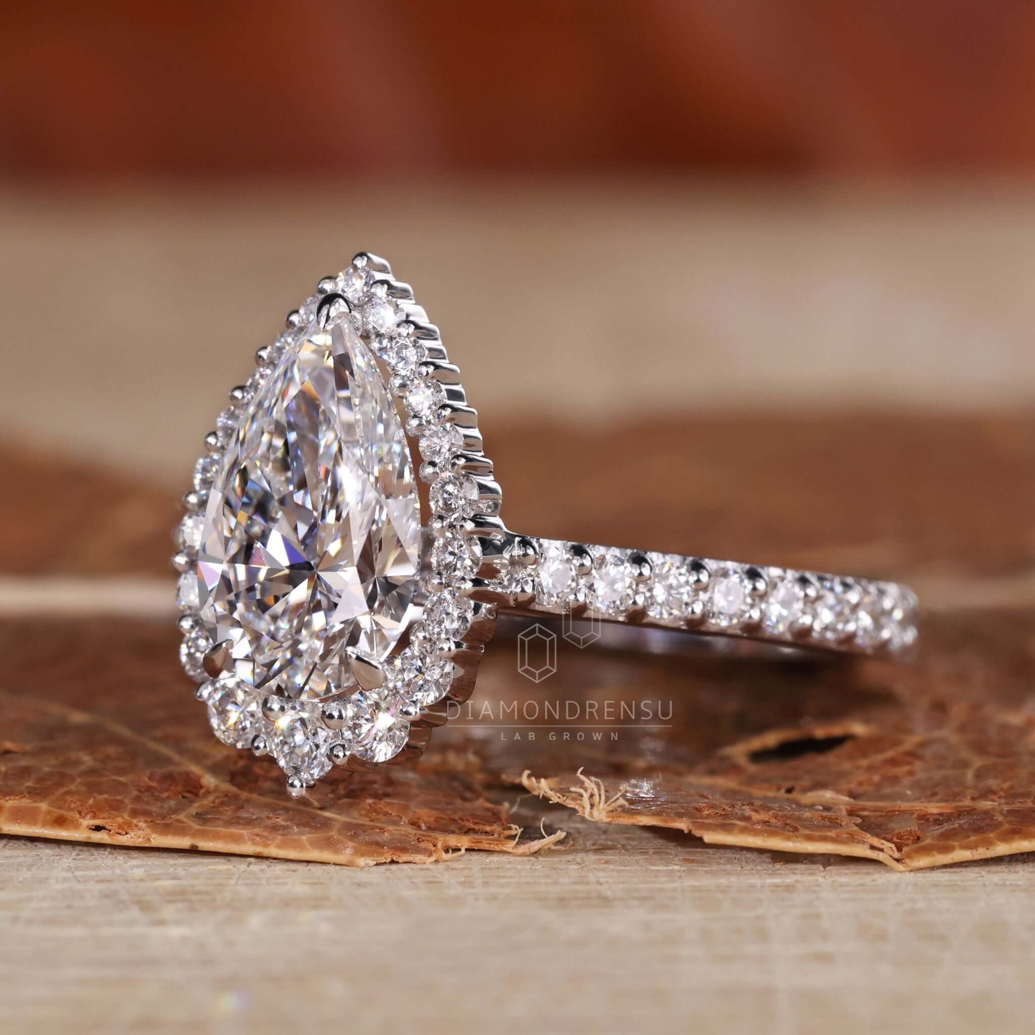 Exquisite pear shaped diamond ring in a halo setting.
