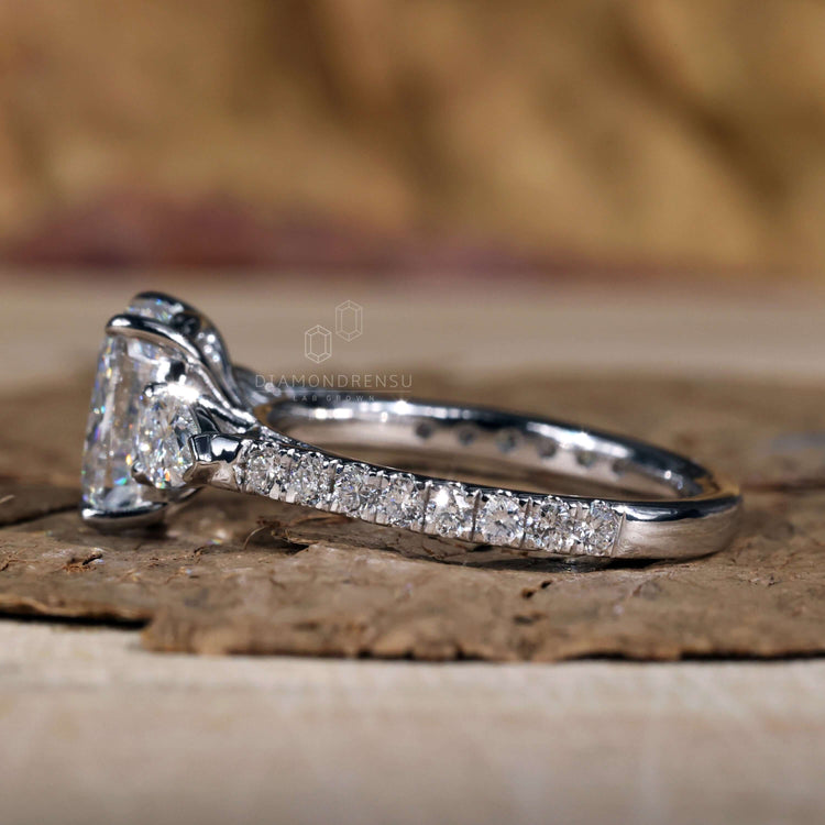 Teardrop ring designed with a unique 4 prong diamond setting