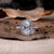 Classic oval diamond halo ring in a handmade jewellery finish.