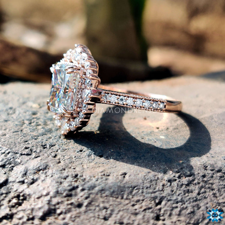 Rose gold engagement ring with double claw prongs.