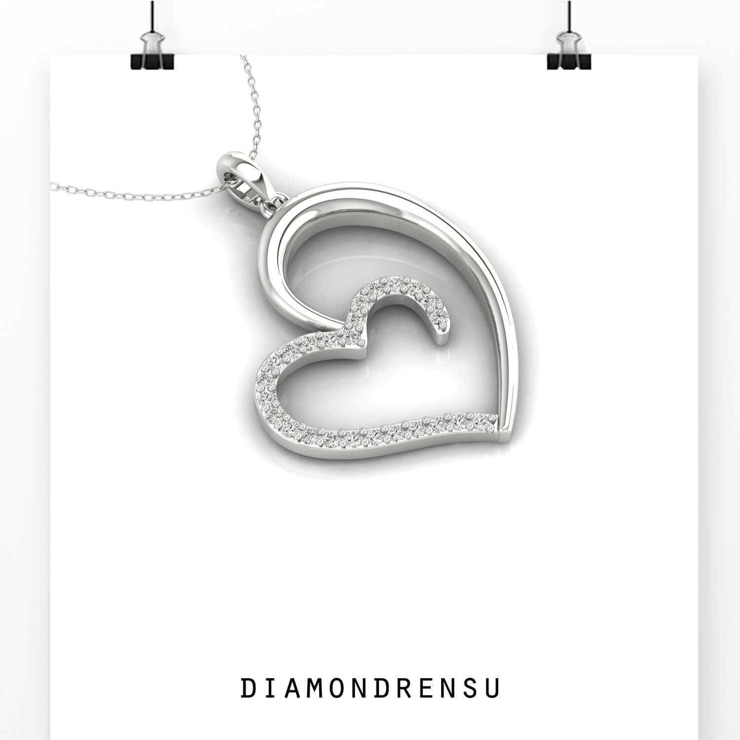Rose gold pendant featuring heart design and diamond accent.