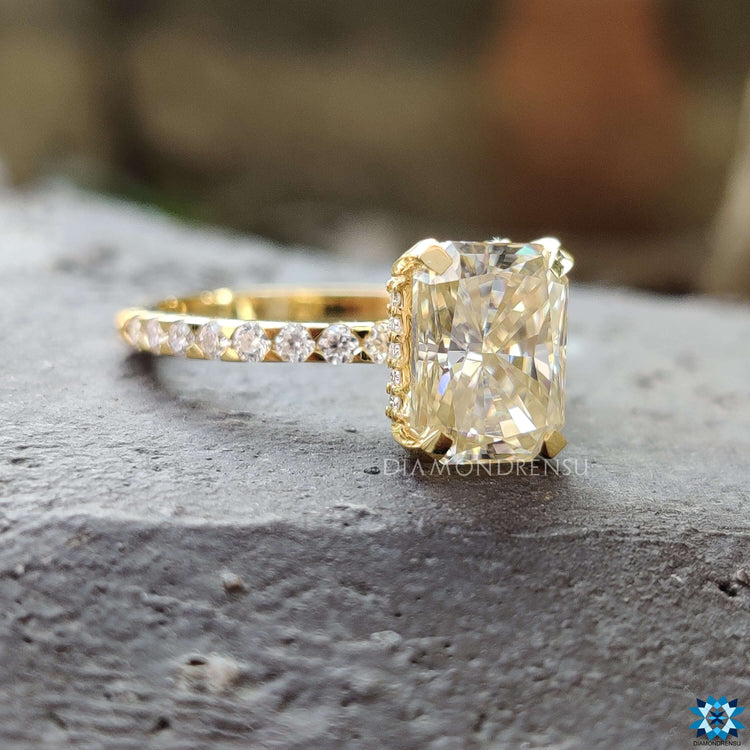 Pave setting engagement ring with radiant moissanite.