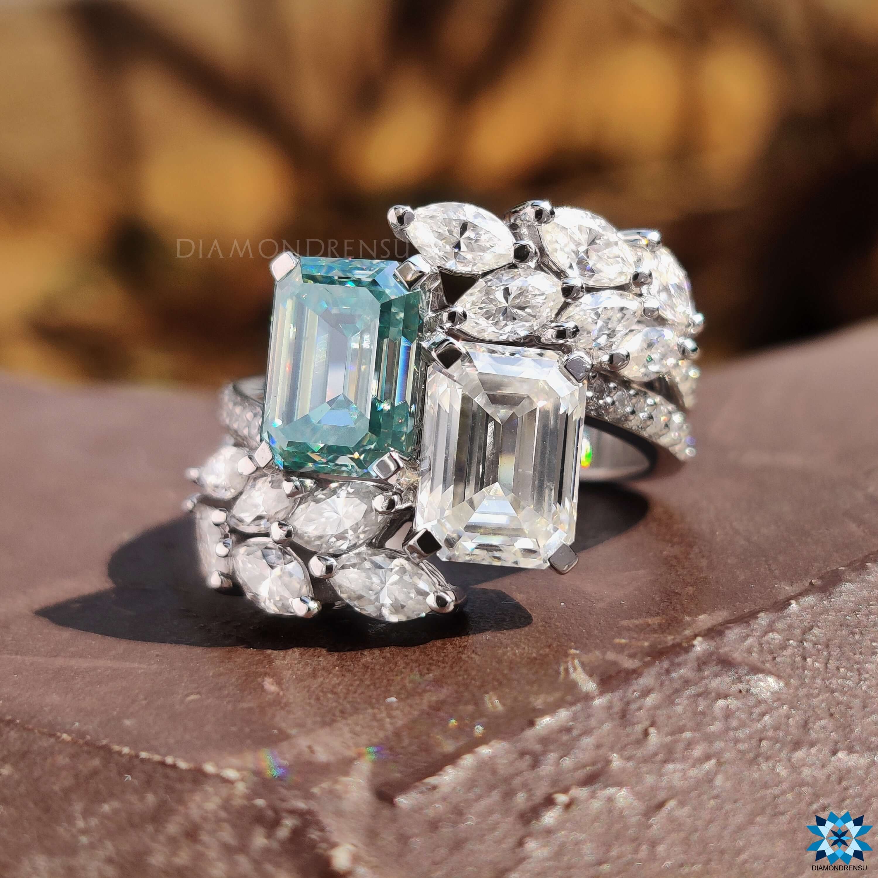 Custom emerald cut engagement ring with side stones.