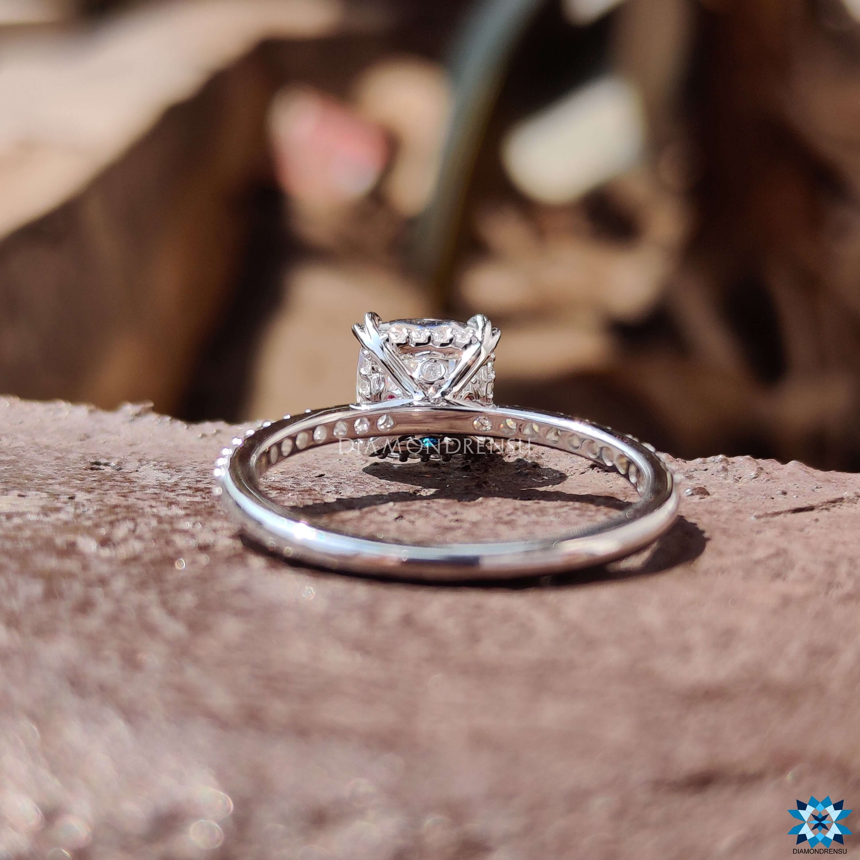 Tourmaline hidden accent on white gold moissanite ring.