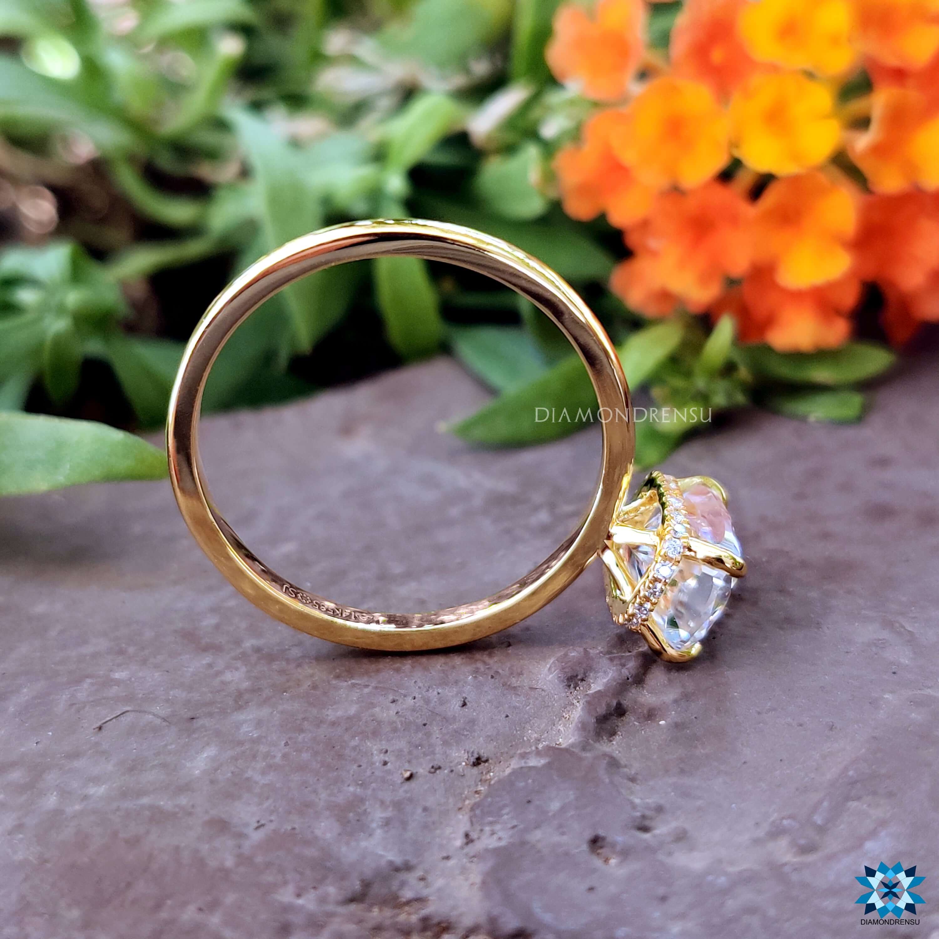 Custom engagement ring with hidden halo and cushion cut moissanite.