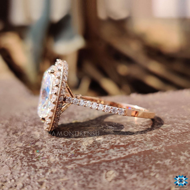 Cathedral setting ring with round cut pave band.