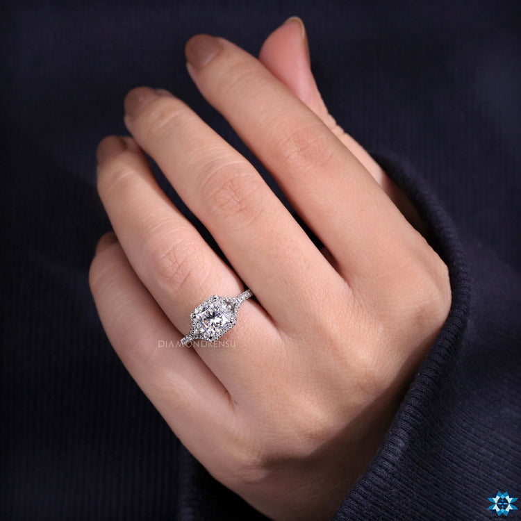 Split shank ring with round halo setting.