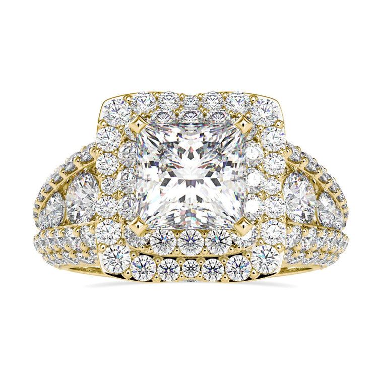 Princess cut halo engagement ring with split shank.