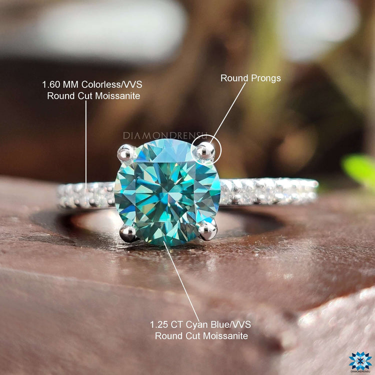 Moissanite engagement ring with white gold band.