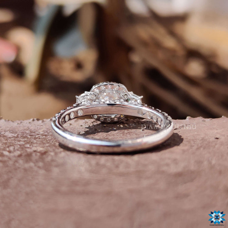 Custom engagement ring with halo setting and side trapezoid moissanites.