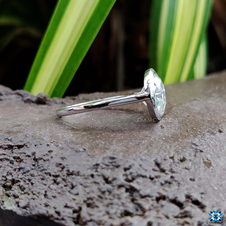 Bezel setting engagement ring in white gold.