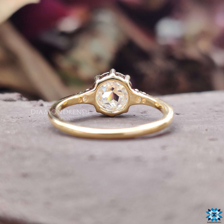 Buy moissanite ring with rose cut centre and round cut side stones.