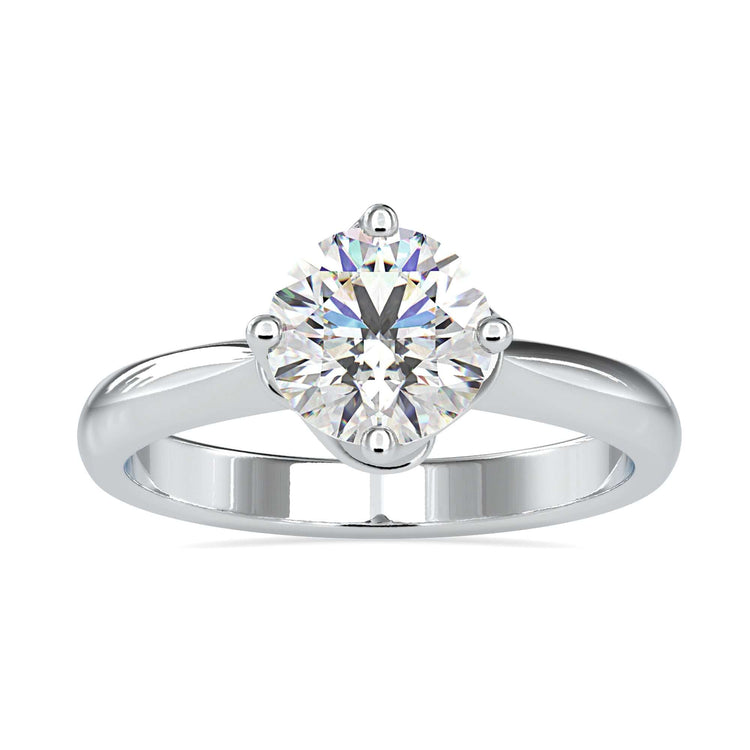 Round cut diamond set in compass prong rose gold ring.