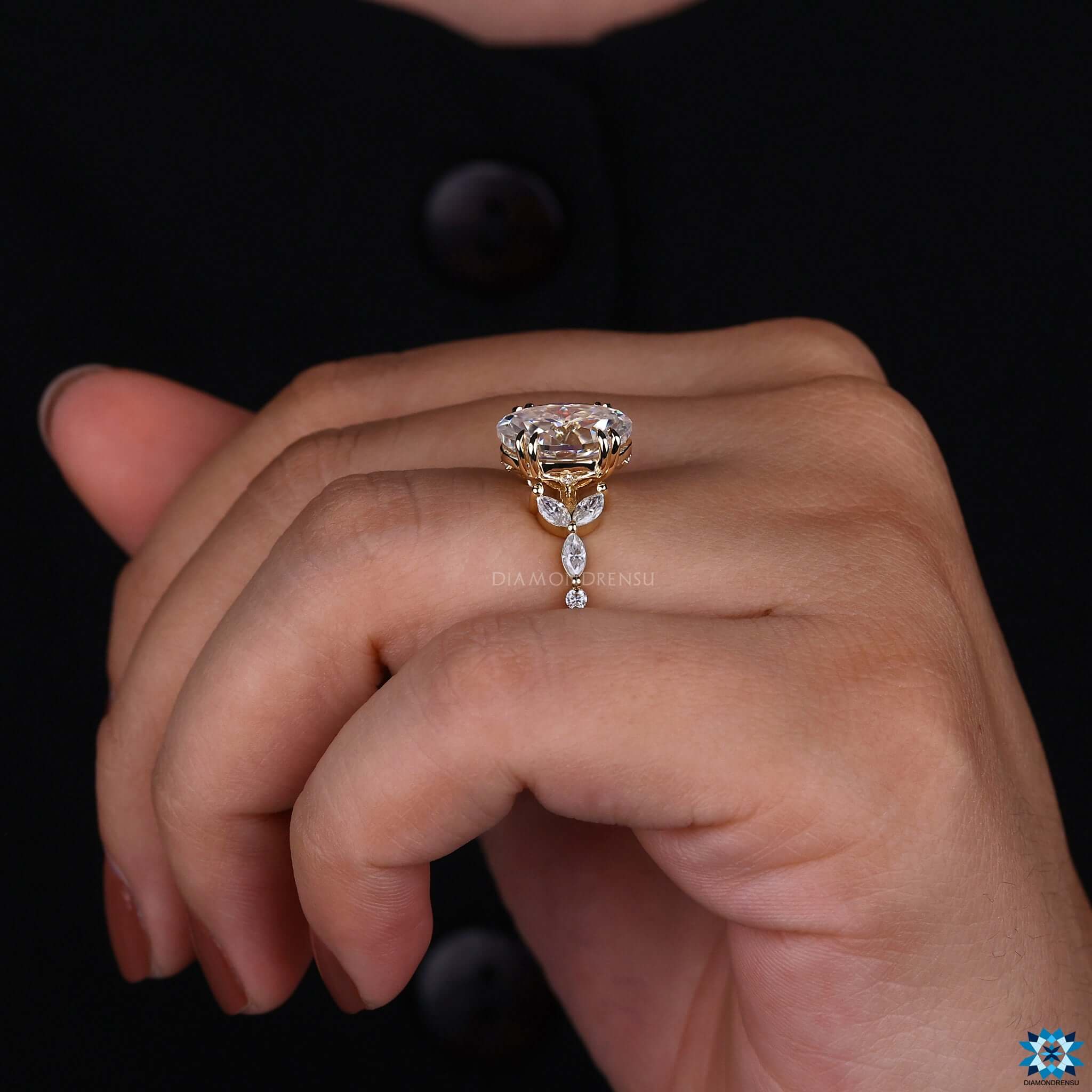 Elegant proposal ring with oval Rensu cut stone and vintage side accents.