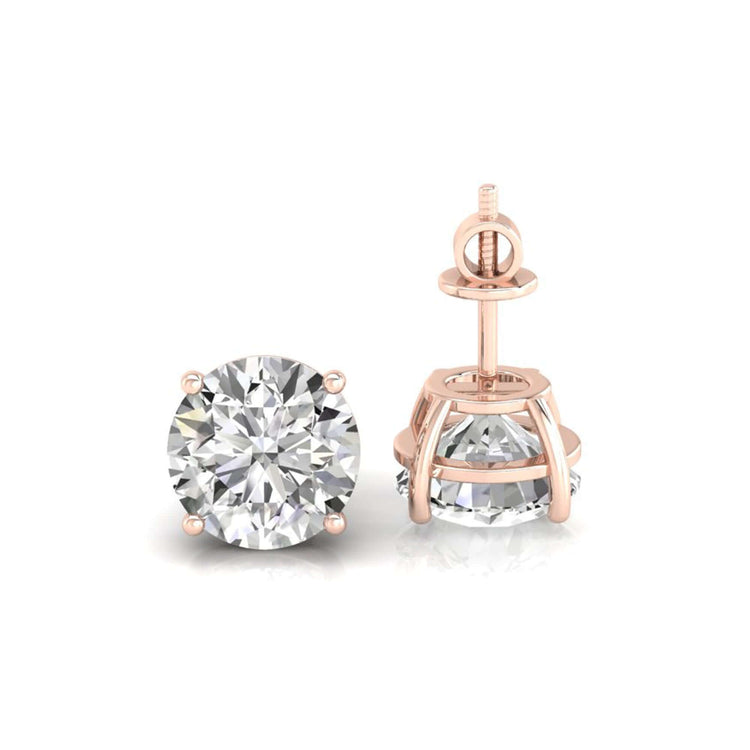 Prong setting earrings holding round brilliant cut diamonds.