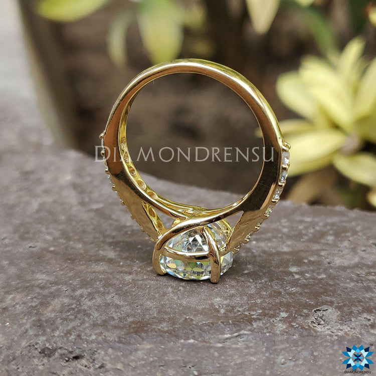 Pave setting moissanite ring with yellow gold band.
