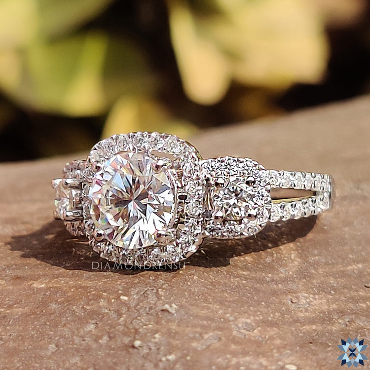 Three stone moissanite ring in white gold setting.
