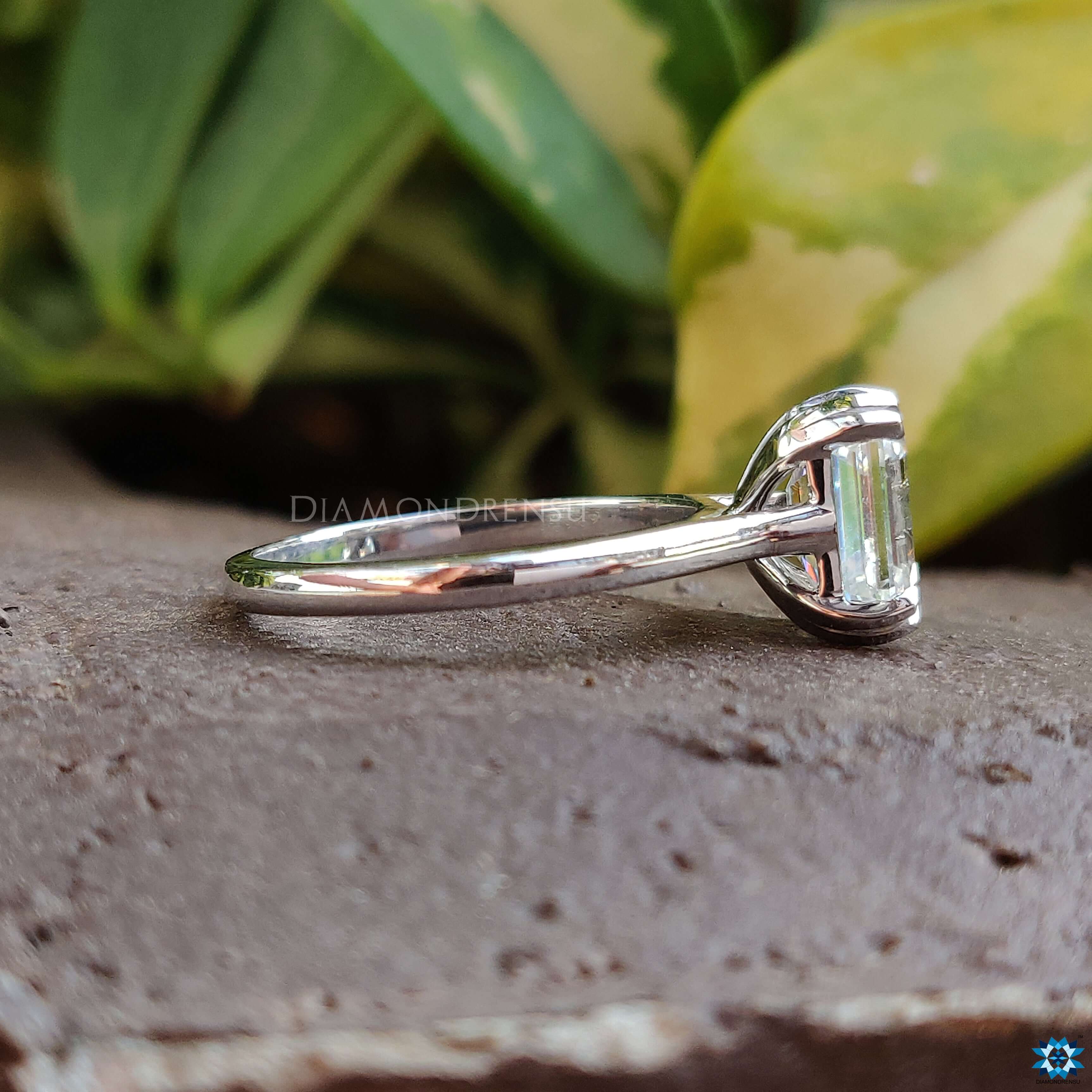 Diamondrensu UK emerald cut moissanite ring in white gold.