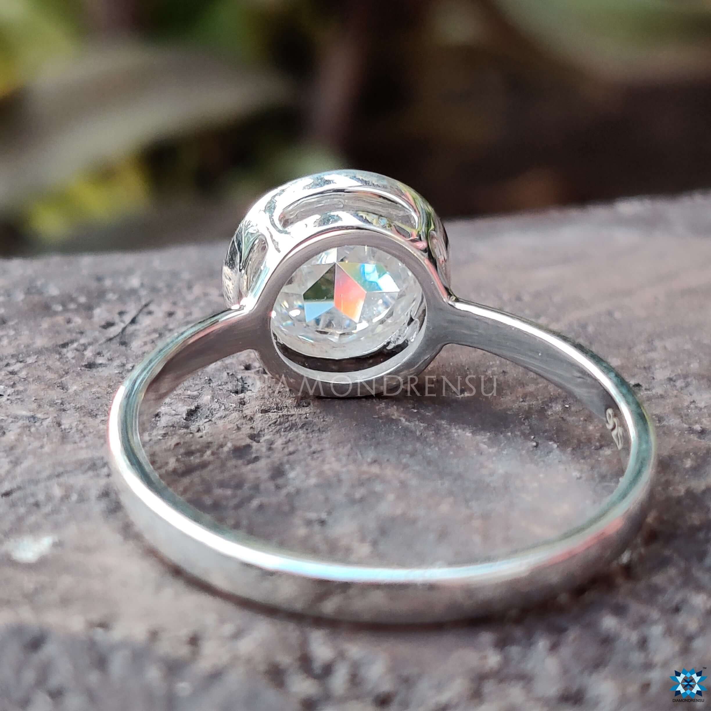 Handmade jewellery piece with bezel set Moissanite in classic solitaire style.