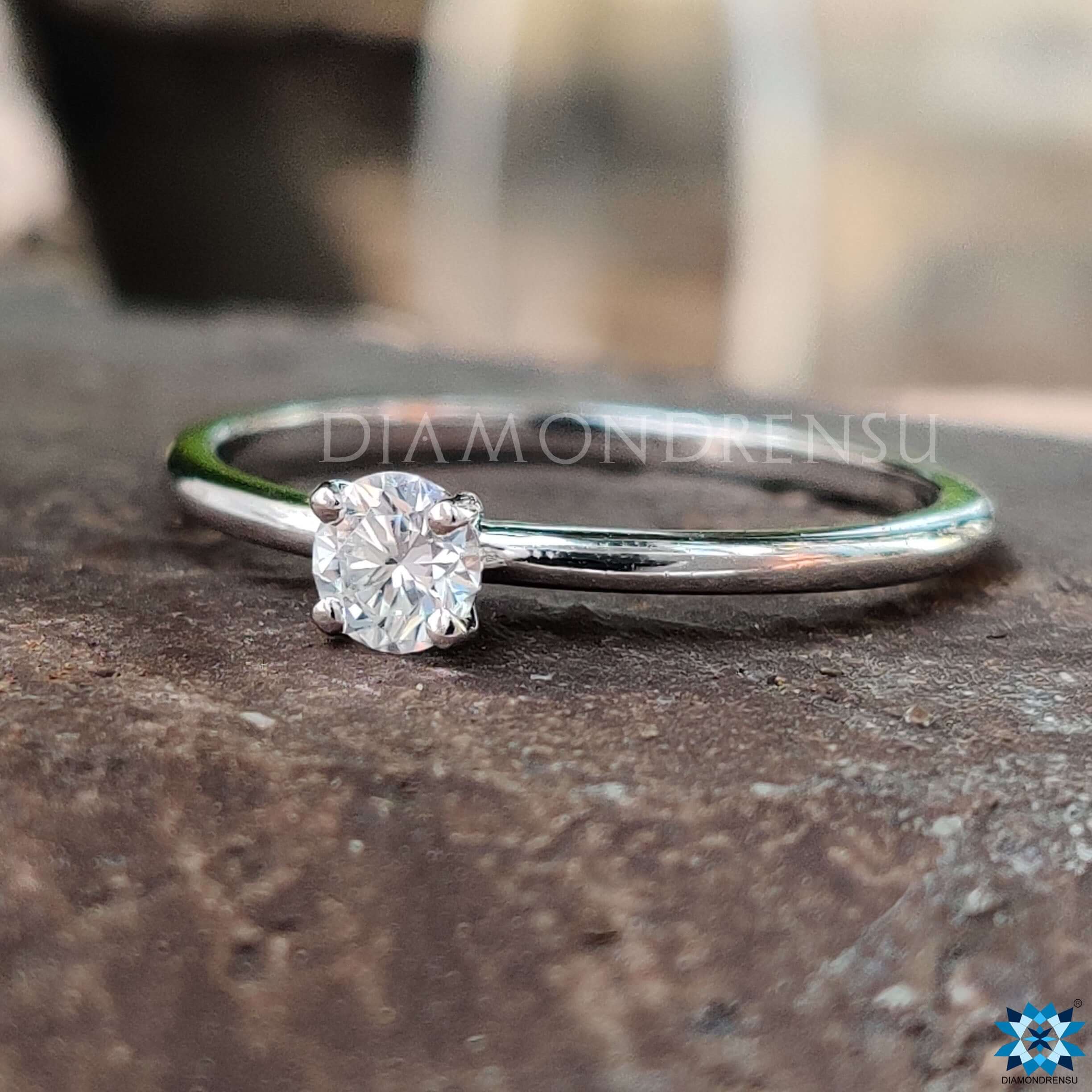 Handmade minimalist round moissanite ring.