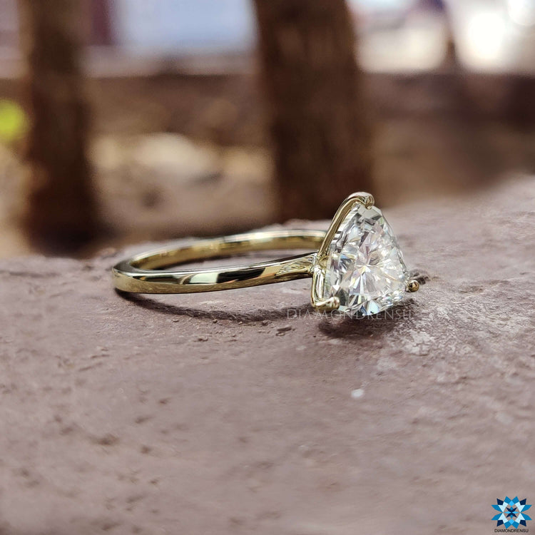 Moissanite solitaire ring with prong setting.
