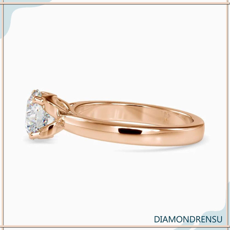 Rose gold engagement ring with round solitaire diamond, UK made.