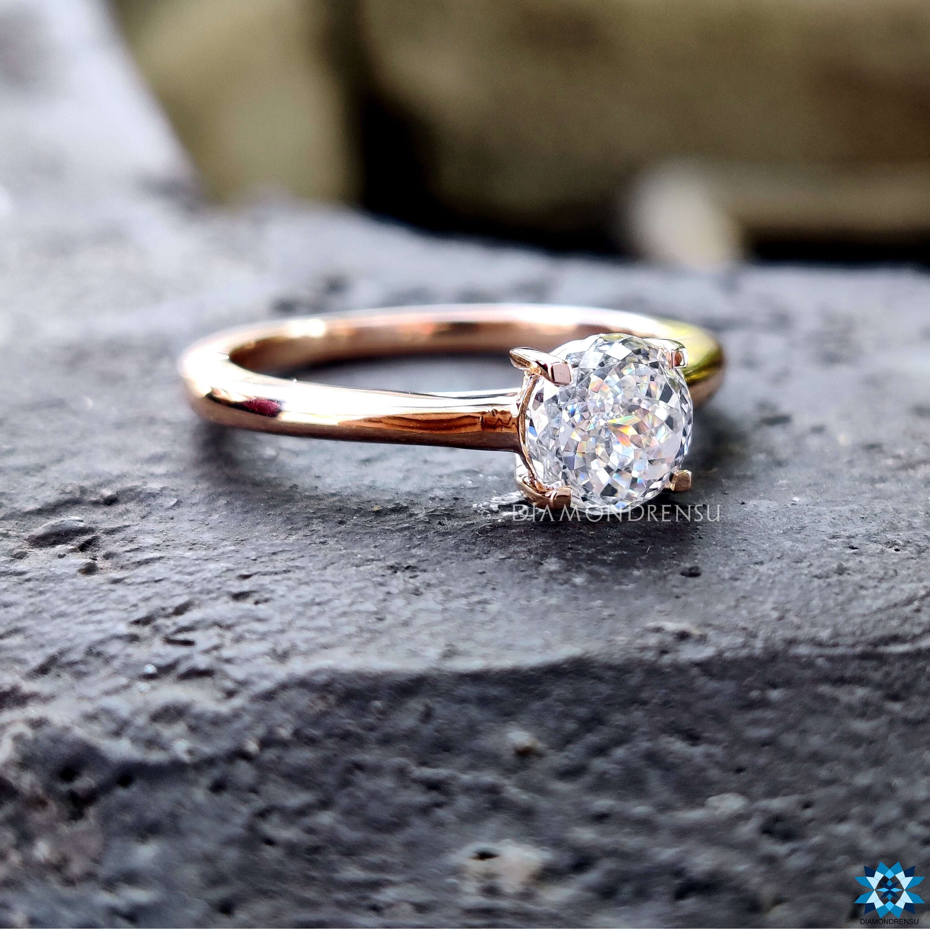Rose gold ring featuring Portuguese cut moissanite.