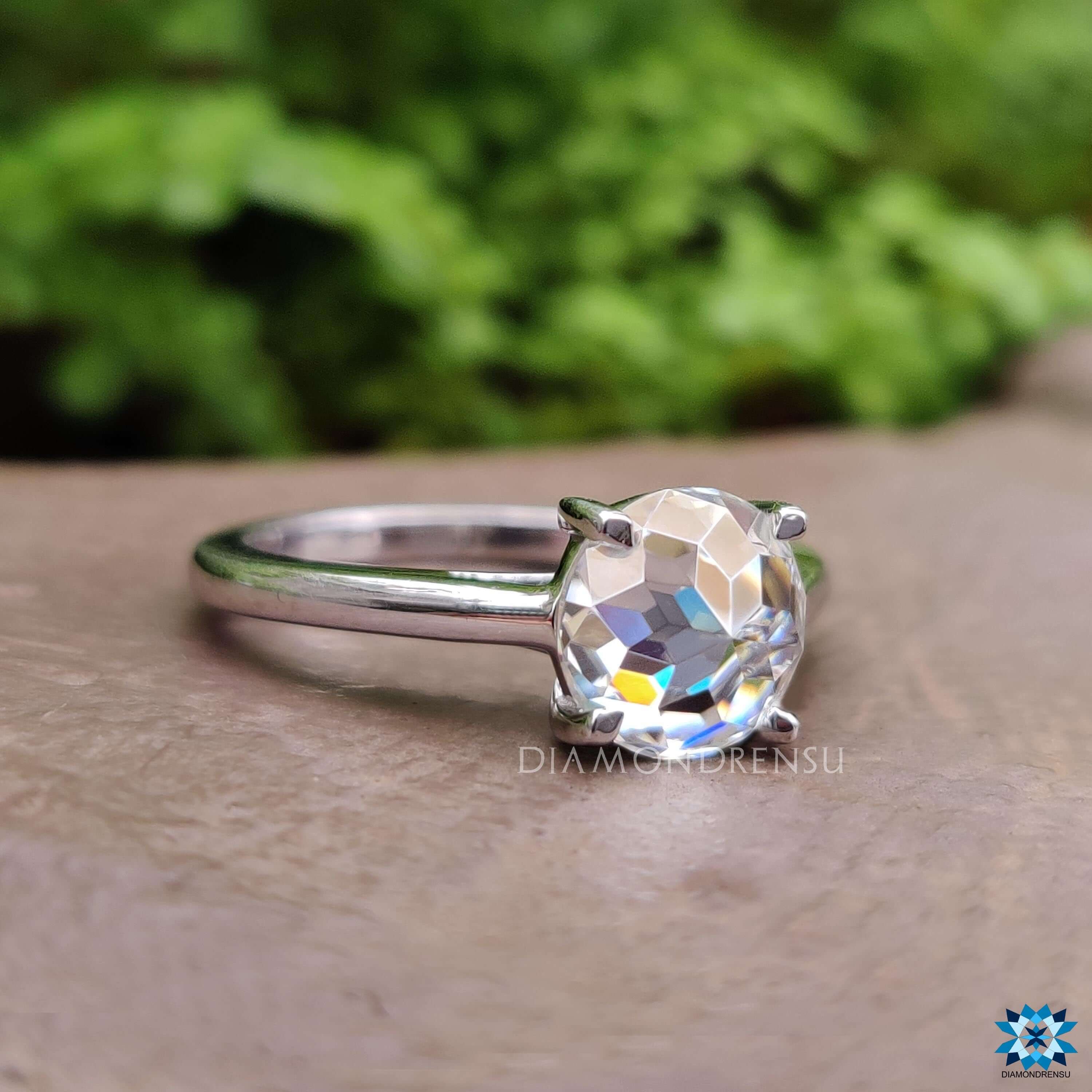 Handmade rose cut moissanite ring with 4 claw prong setting.