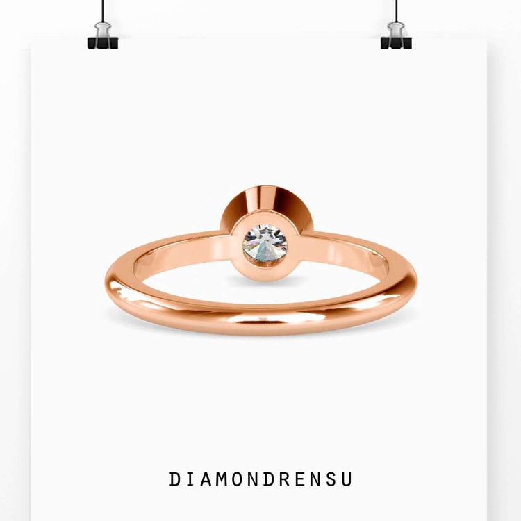 White gold bezel setting ring with handmade solitaire design.