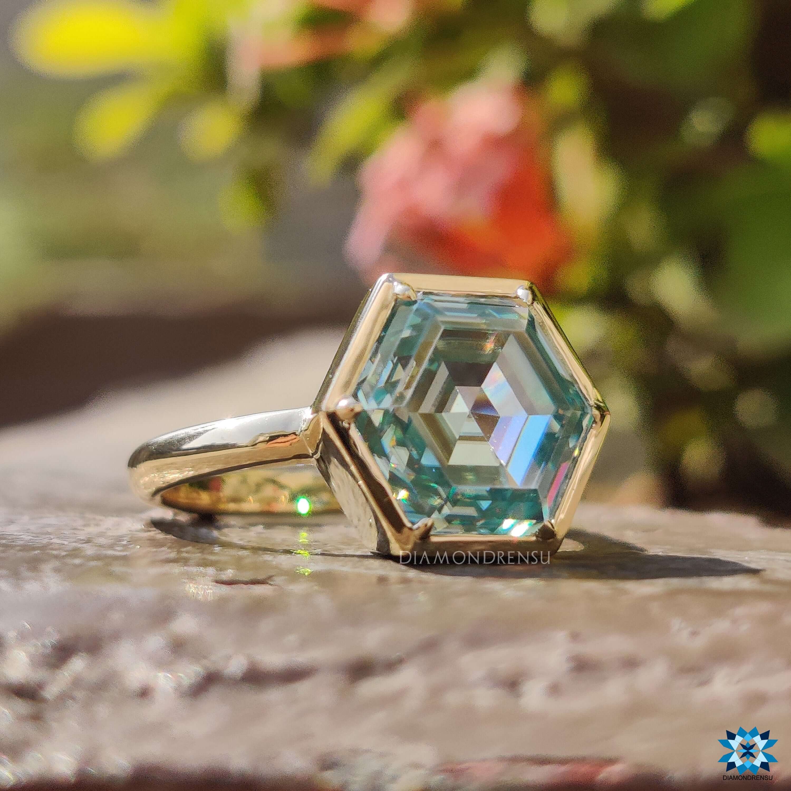 Handmade yellow gold moissanite solitaire ring with bezel setting.