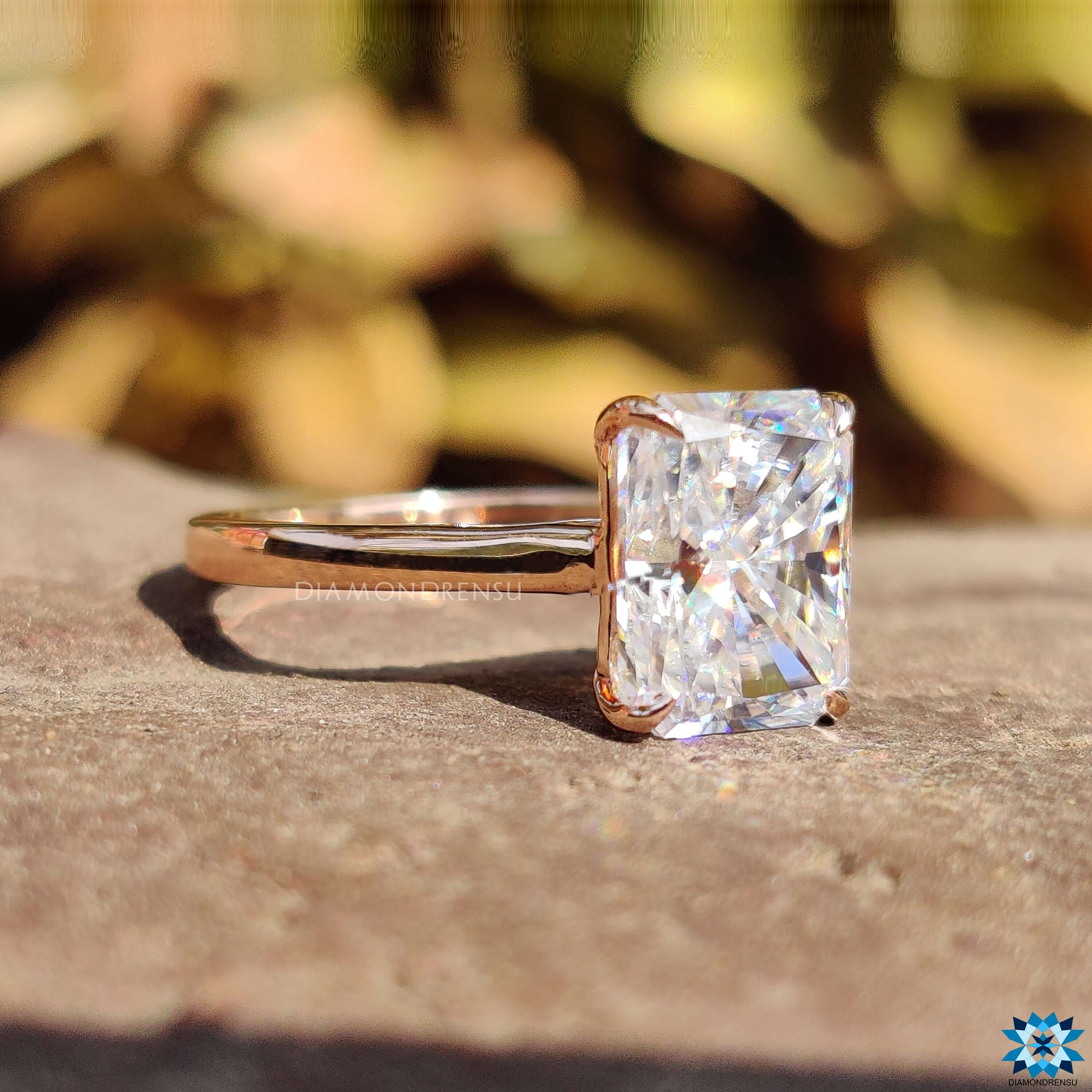 Rose gold radiant moissanite engagement ring.