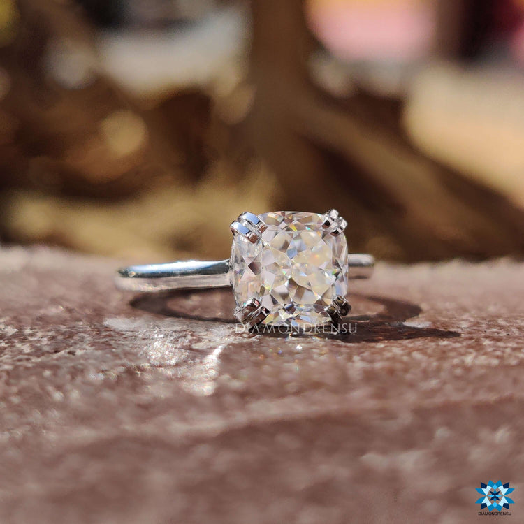 Handmade white gold solitaire ring with cushion moissanite.