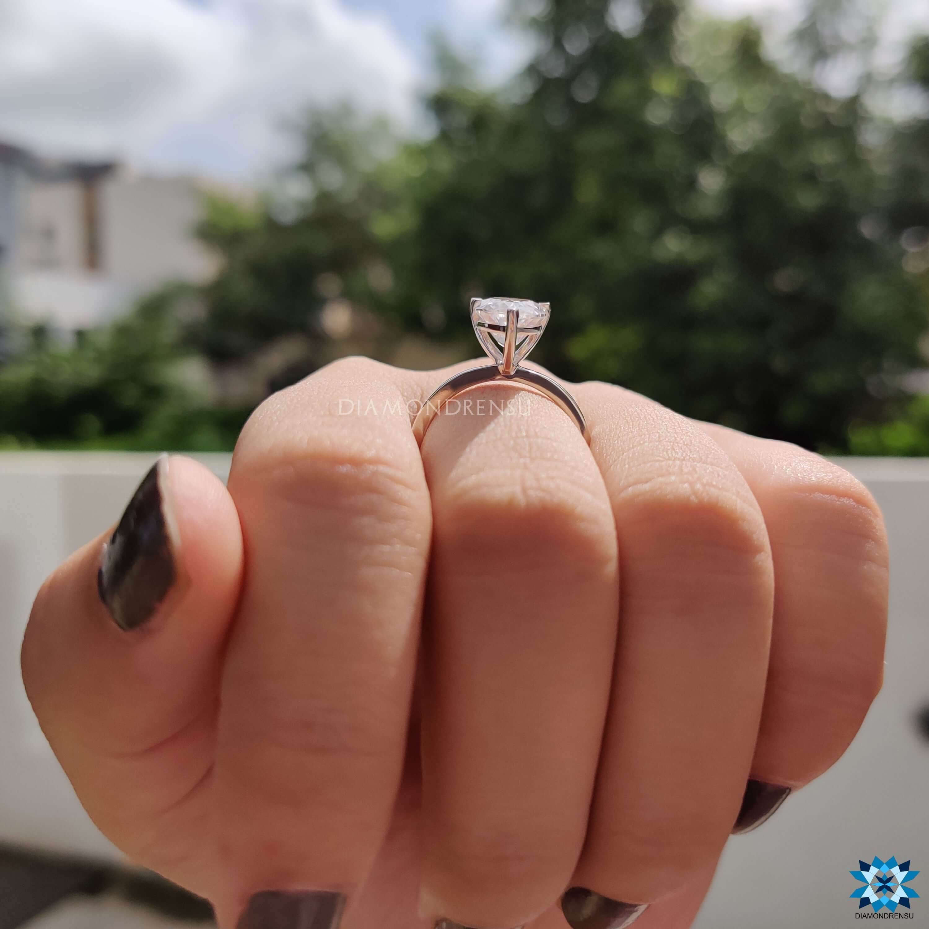 Handmade jewellery with pear cut moissanite in prong mount.